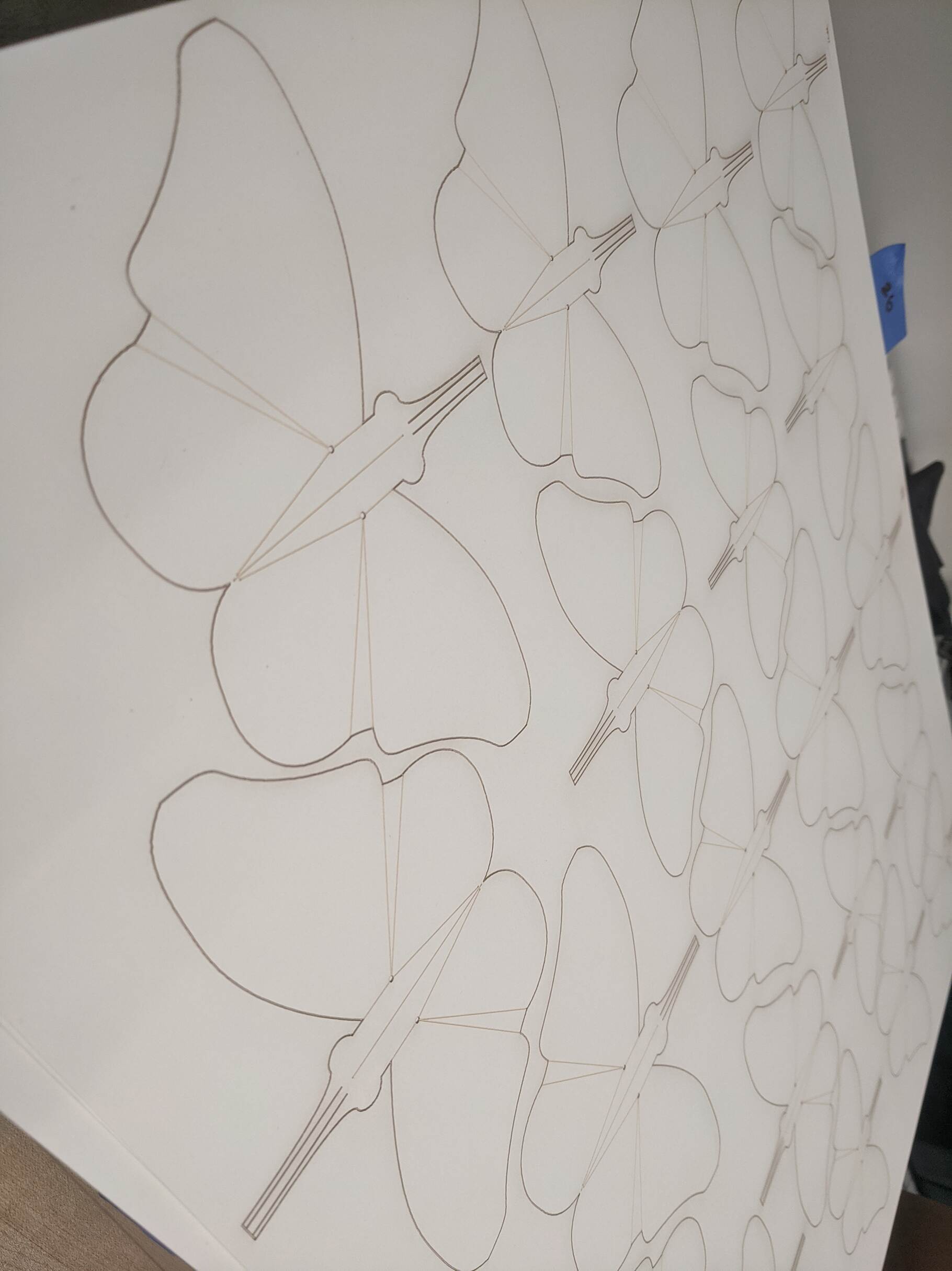 Full sheet of unfolded butterflies off the laser-cutter